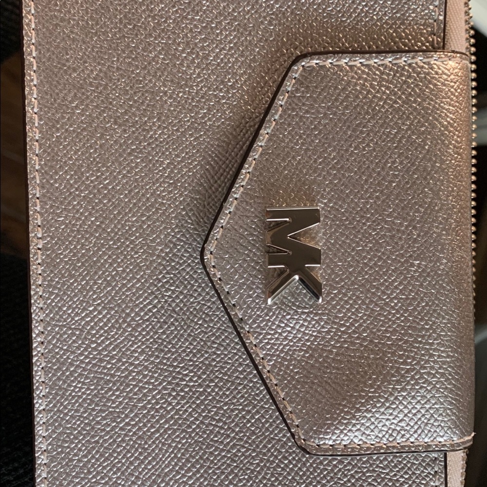 MK cross body or wallet.  Never used!